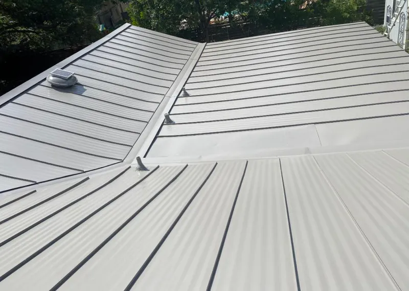 Solar attic fan installed on a metal roof for Roof Ventilation in Spanish Lake